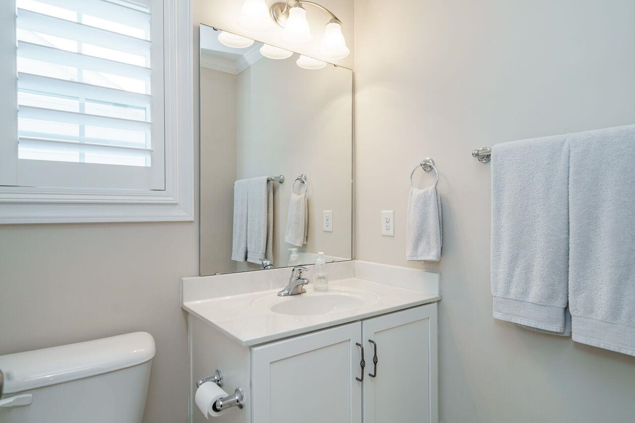 3003 Red Grape Drive Raleigh, NC 27607 - Photo 26 of 35 Easy to share bathroom with white cabinetry and tile! Bathroom