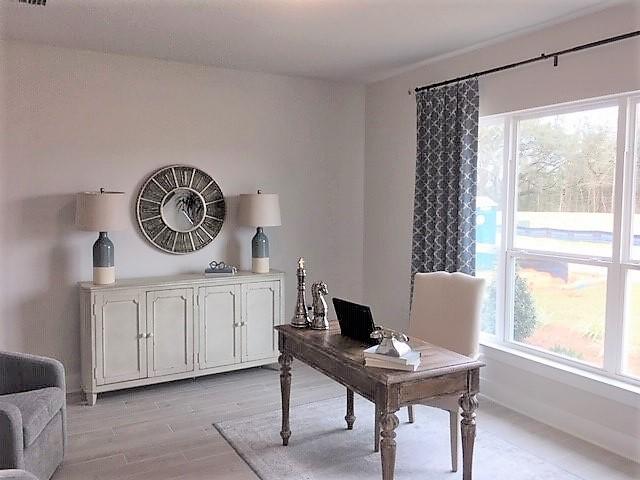 6068 Carina Road Crestview, FL 32539 - Photo 10 of 28 a view of a workspace with furniture and a window