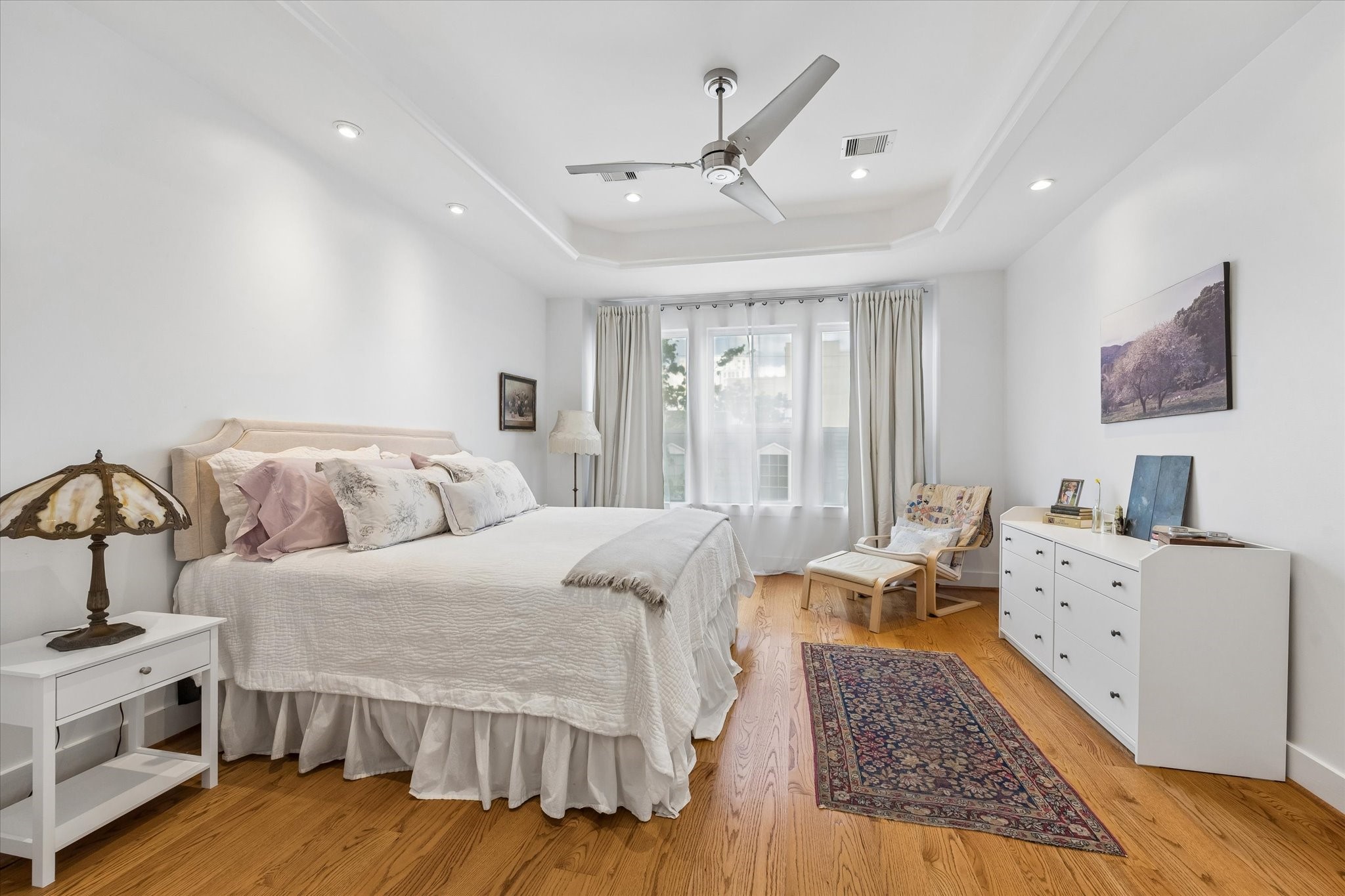 1518 West Clay Street Houston, TX 77019 - Photo 19 of 36 Sunlit spacious primary bedroom with views to rear patio and garden.