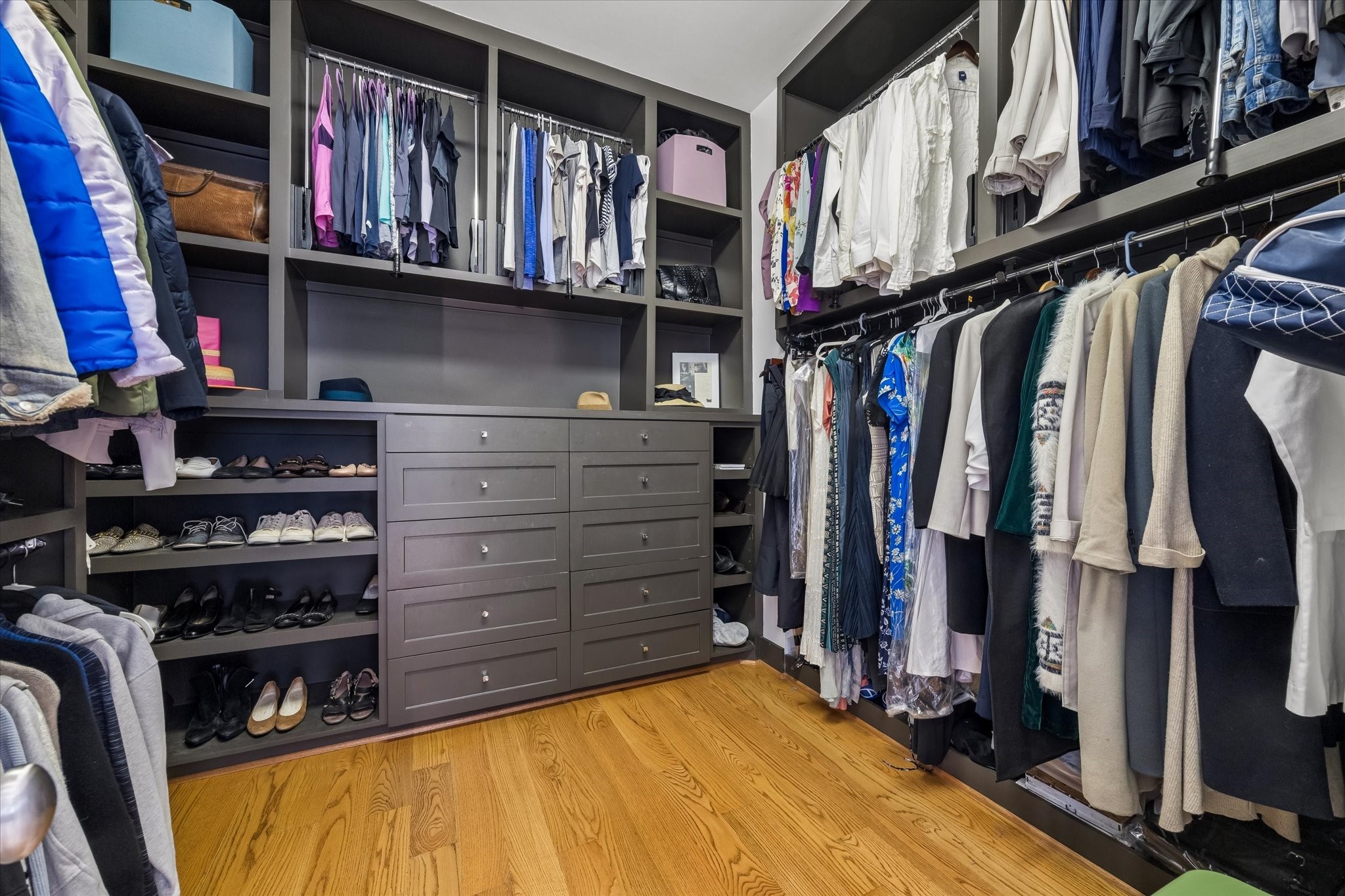 1518 West Clay Street Houston, TX 77019 - Photo 22 of 36 Wonderful primary closet with great built in storage space for shoes, folded articles and hanging clothing.