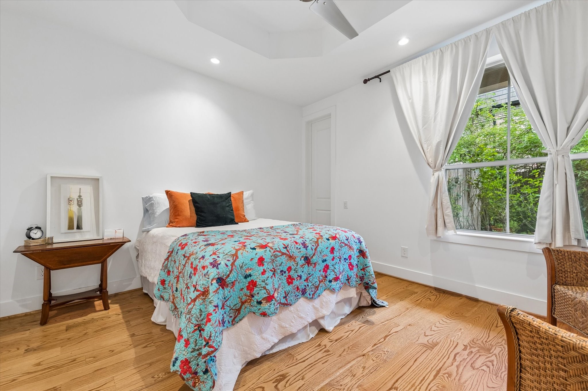 1518 West Clay Street Houston, TX 77019 - Photo 7 of 36 At the end of the hallway is a first floor bedroom looking onto a lush patio and garden.