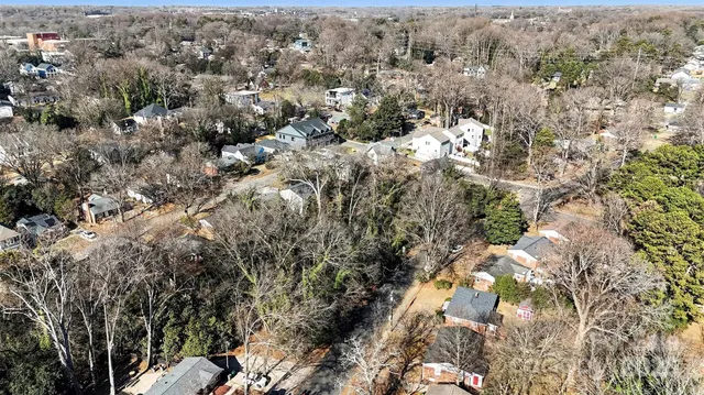 an aerial view of house with yard and mountain view