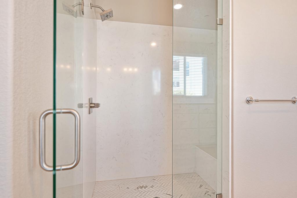 504 Chase Court Colfax, CA 95713 - Photo 59 of 94 a bathroom with a glass shower door