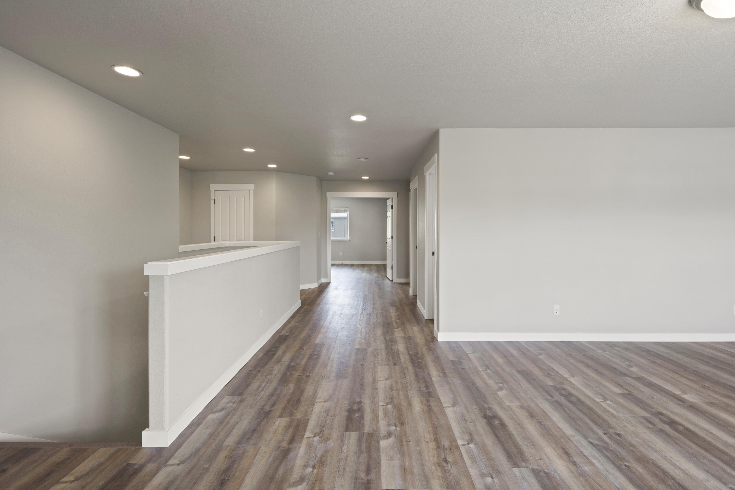 21189 Ritz Place Bend, OR 97702 - Photo 19 of 37 a view of a room with wooden floor and staircase