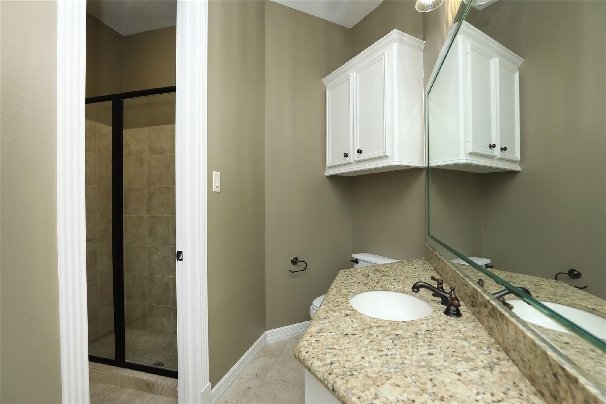 13810 Nathan Ridge Lane Cypress, TX 77429 - Photo 13 of 50 a bathroom with a sink and a mirror