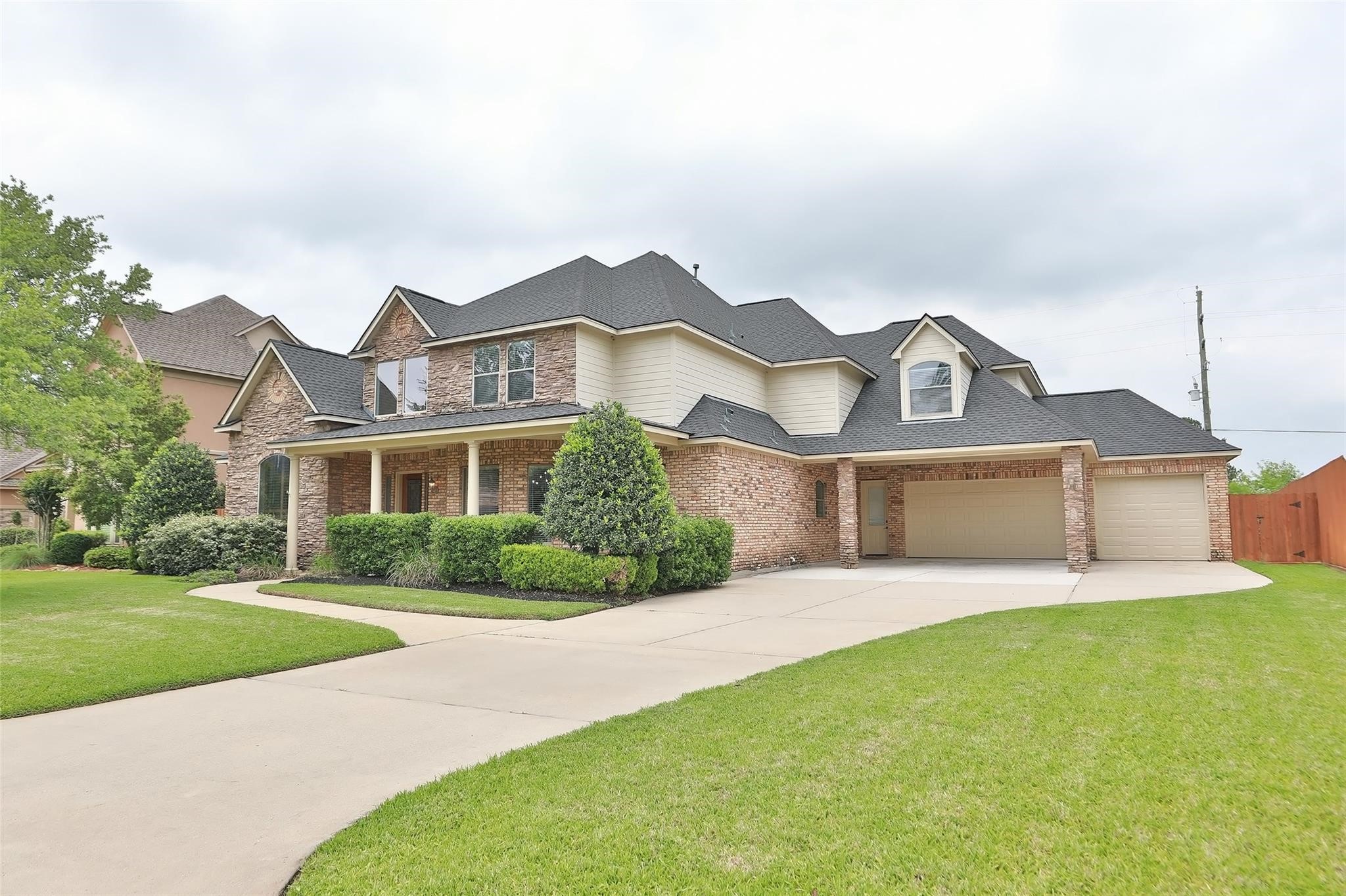 13810 Nathan Ridge Lane Cypress, TX 77429 - Photo 2 of 50 a front view of a house with a yard and garage
