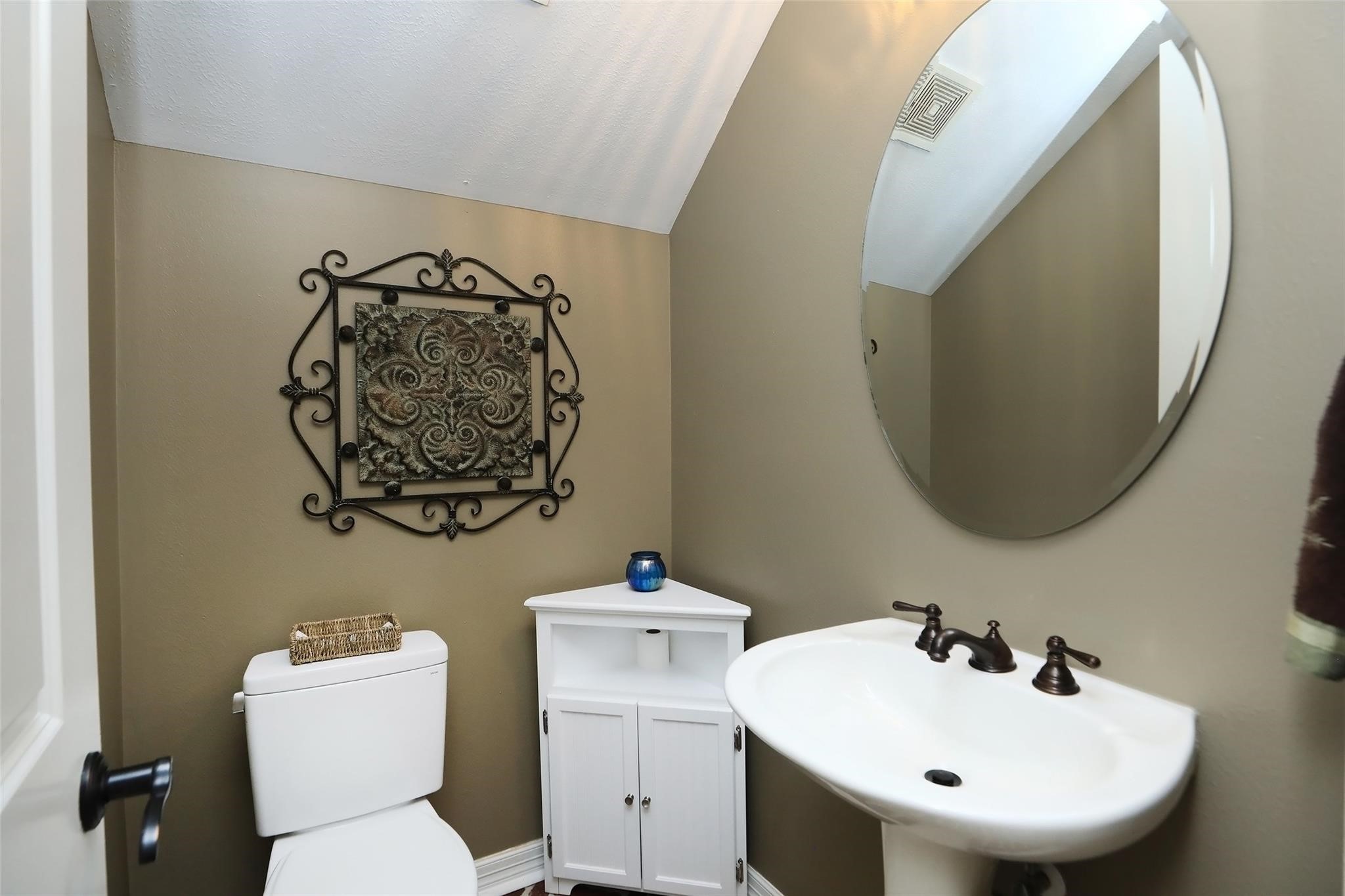 13810 Nathan Ridge Lane Cypress, TX 77429 - Photo 25 of 50 a bathroom with a toilet sink and mirror