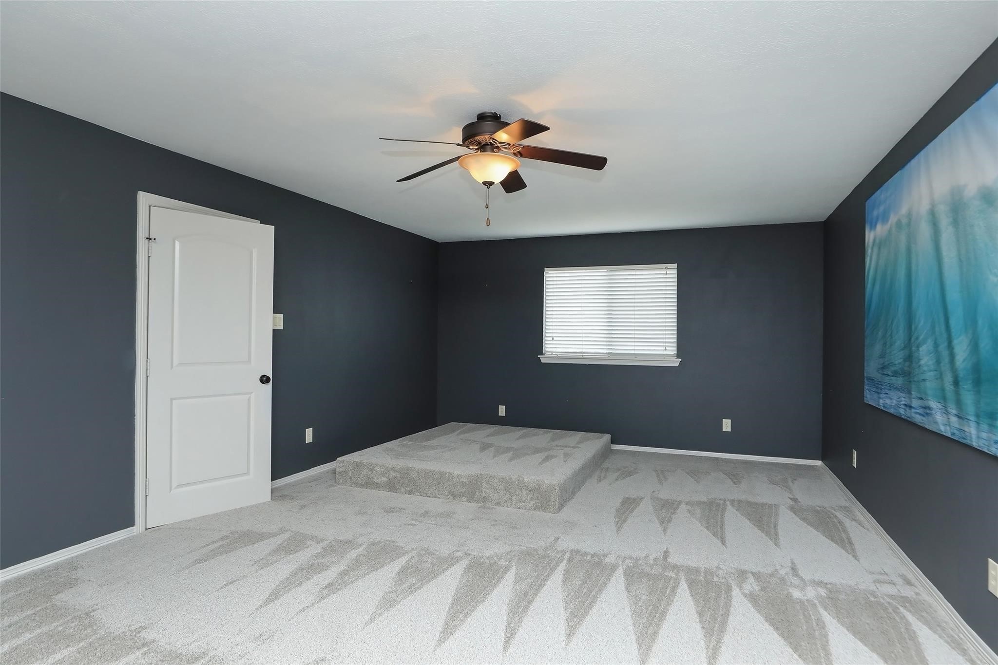 13810 Nathan Ridge Lane Cypress, TX 77429 - Photo 36 of 50 a bedroom with a large bed and a chandelier fan