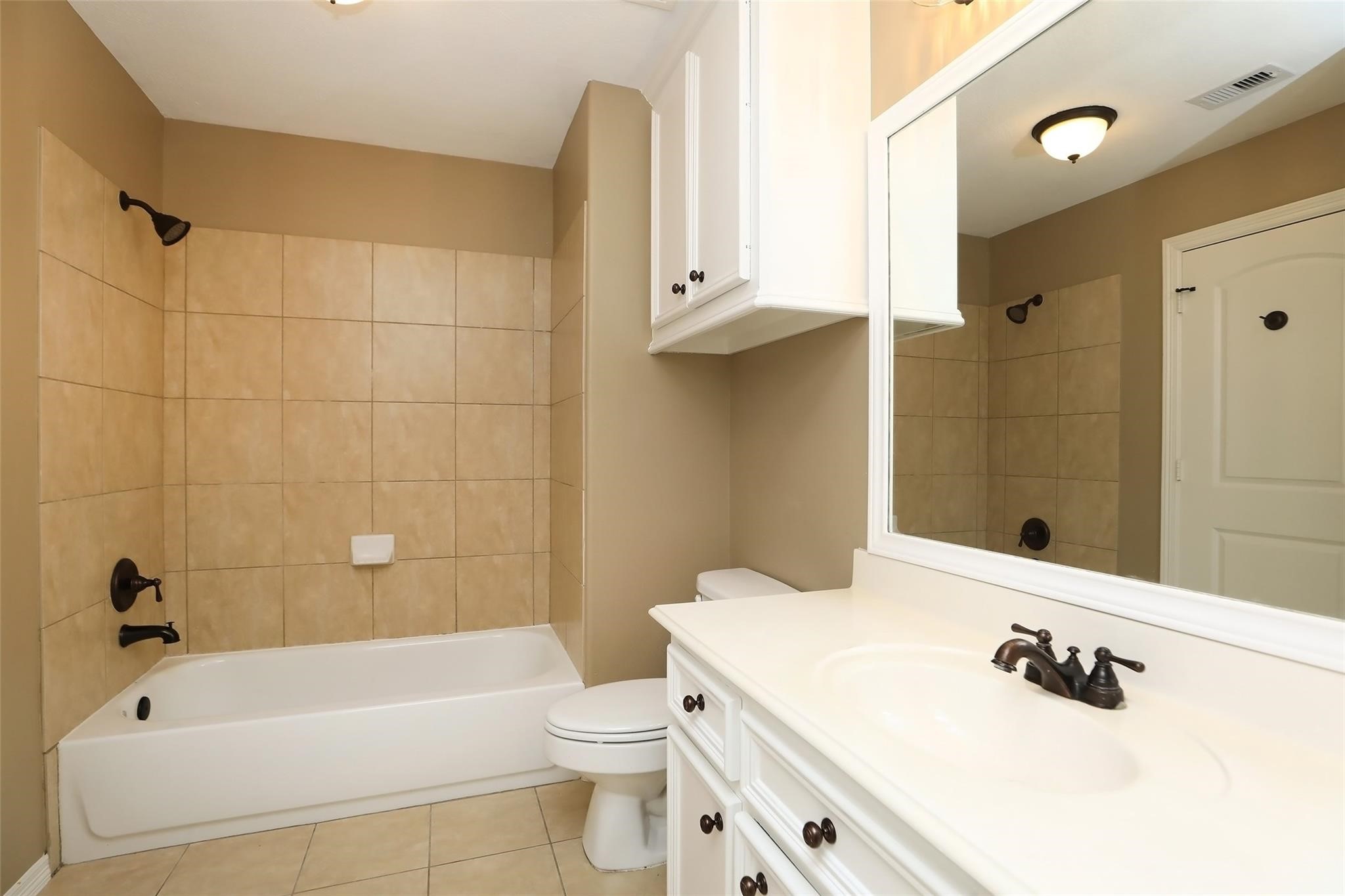 13810 Nathan Ridge Lane Cypress, TX 77429 - Photo 38 of 50 a bathroom with a sink a toilet and shower