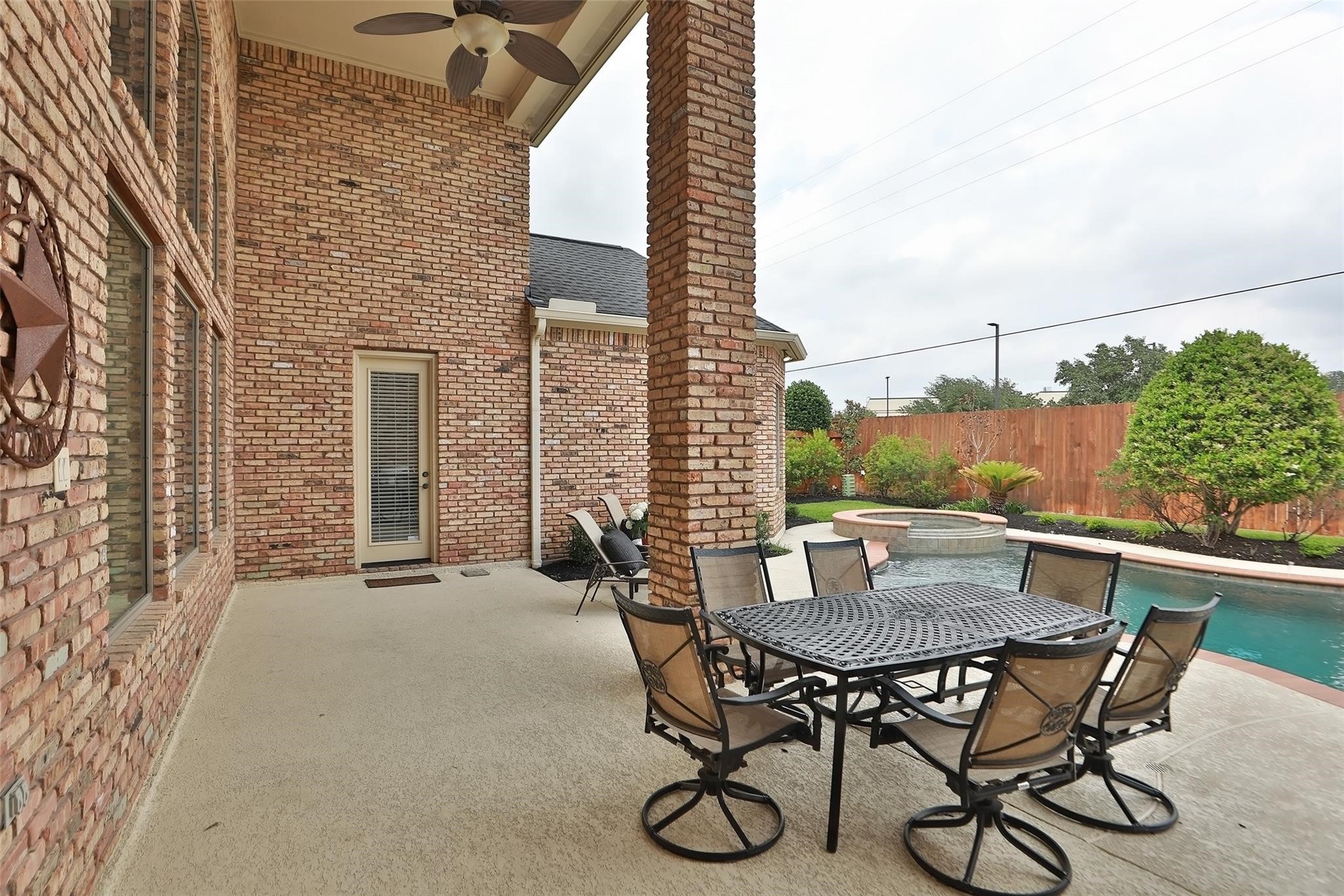 13810 Nathan Ridge Lane Cypress, TX 77429 - Photo 41 of 50 a view of a patio with table and chairs and potted plants