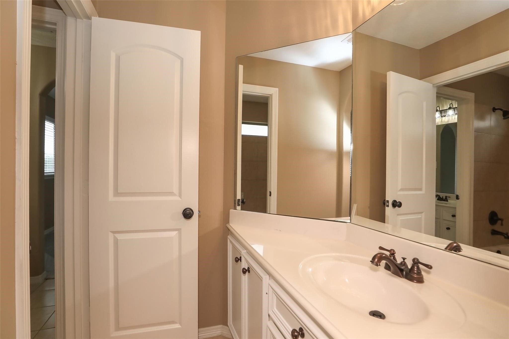 13810 Nathan Ridge Lane Cypress, TX 77429 - Photo 42 of 50 a bathroom with a sink and a mirror