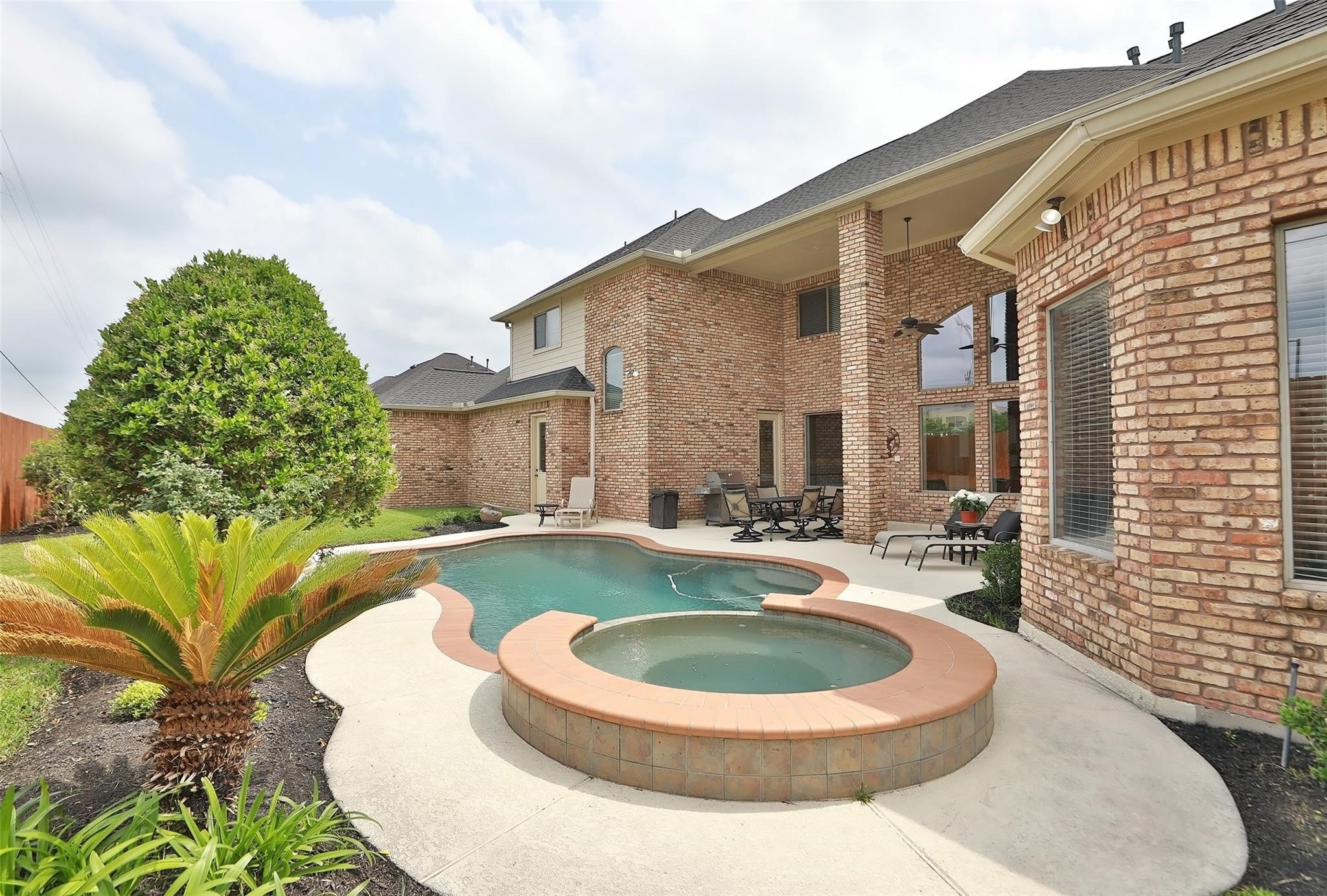 13810 Nathan Ridge Lane Cypress, TX 77429 - Photo 46 of 50 a view of a house with swimming pool and sitting area