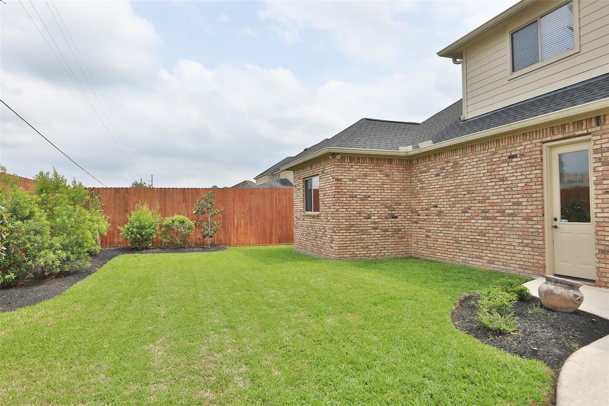 13810 Nathan Ridge Lane Cypress, TX 77429 - Photo 47 of 50 a view of a backyard with potted plants