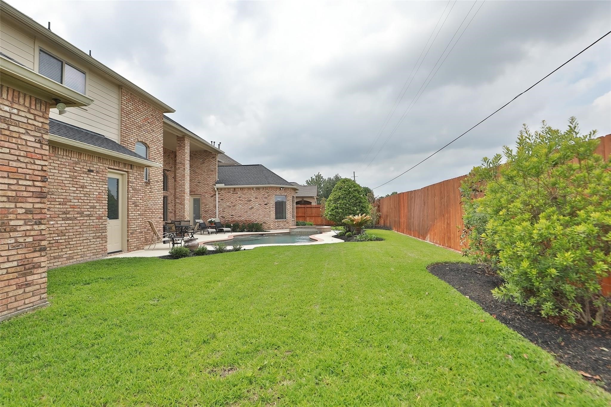 13810 Nathan Ridge Lane Cypress, TX 77429 - Photo 49 of 50 a view of a patio with table and chairs and potted plants