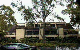 a front view of a house with parking space