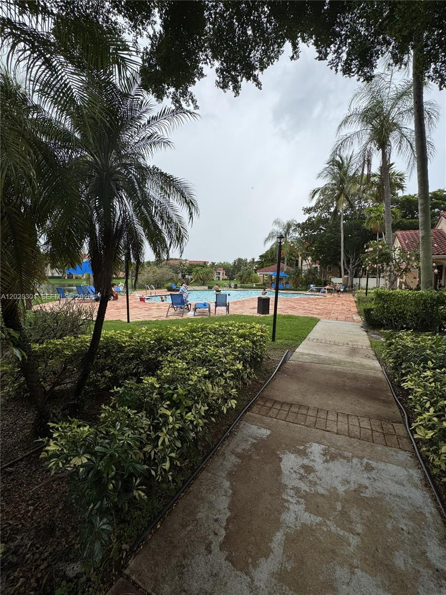 2021 Renaissance Boulevard, Unit 201 Miramar, FL 33025 - Photo 25 of 26 a view of green field with trees