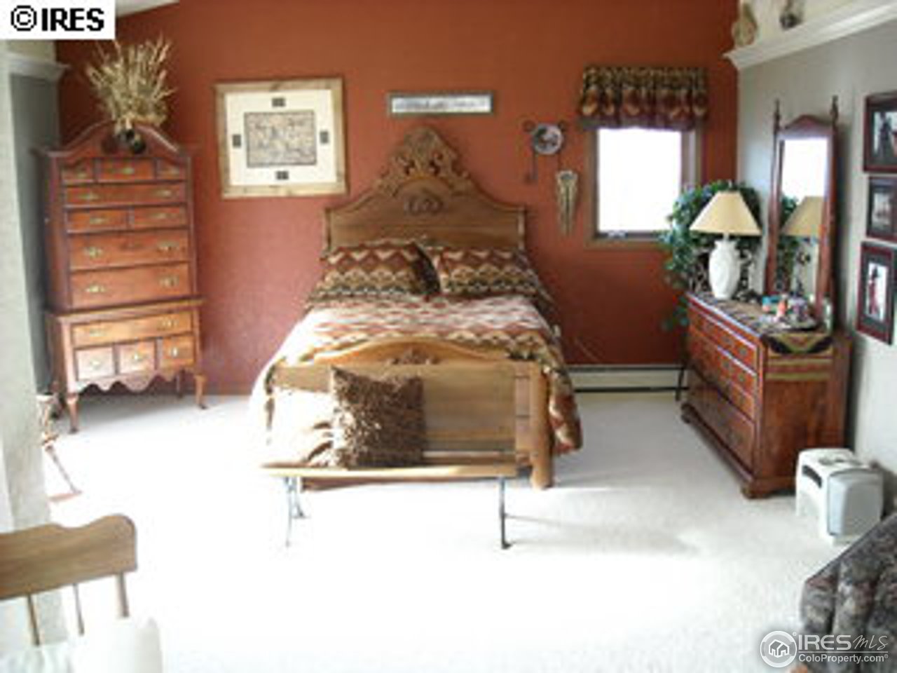 181 Chapman Road Boulder, CO 80302 - Photo 4 of 10 a bedroom with a bed and window