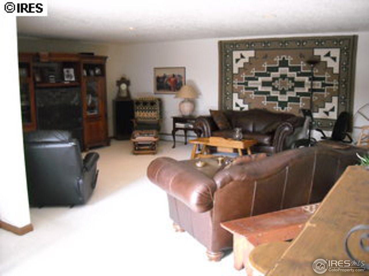 181 Chapman Road Boulder, CO 80302 - Photo 6 of 10 a living room with furniture a window and bookshelf