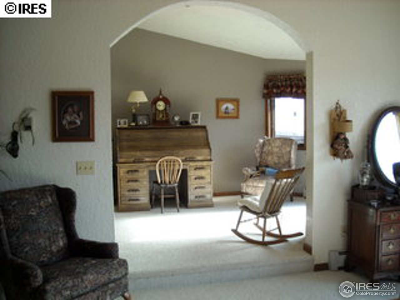 181 Chapman Road Boulder, CO 80302 - Photo 10 of 10 a living room with furniture a flat screen tv and a fireplace