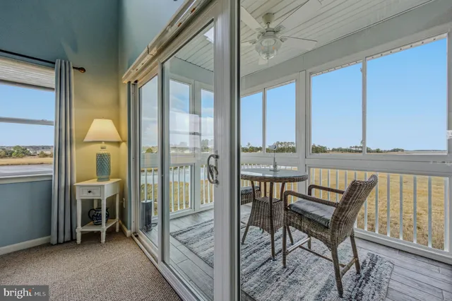 a view of living room kitchen and entryway