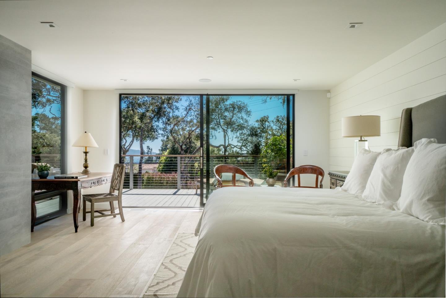 1505 Venadero Road Pebble Beach, CA 93953 - Photo 11 of 36 a view of a bedroom with furniture and floor to ceiling window