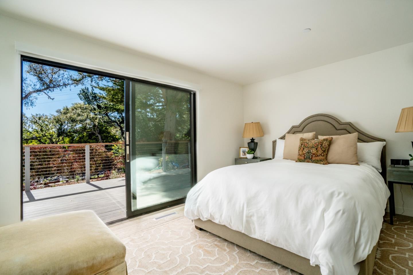 1505 Venadero Road Pebble Beach, CA 93953 - Photo 14 of 36 a bedroom with a large bed and a large window