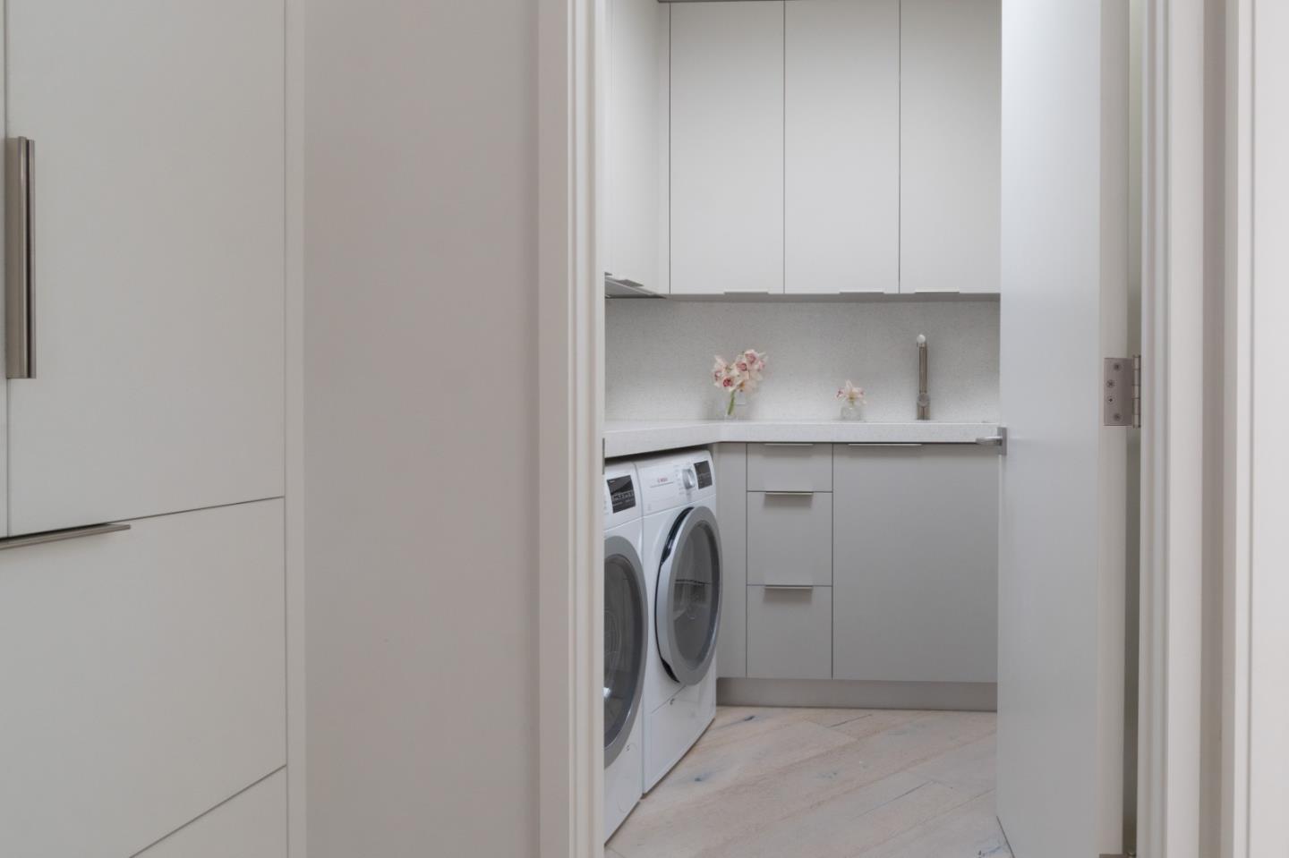 1505 Venadero Road Pebble Beach, CA 93953 - Photo 20 of 36 a utility room with dryer and washer