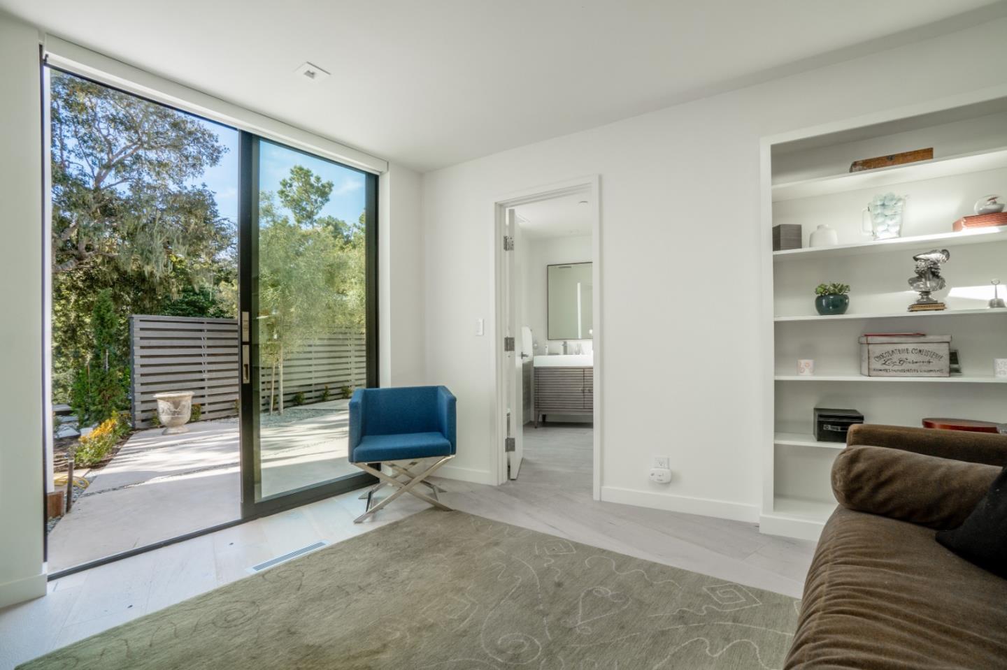 1505 Venadero Road Pebble Beach, CA 93953 - Photo 22 of 36 a living room with furniture and a floor to ceiling window