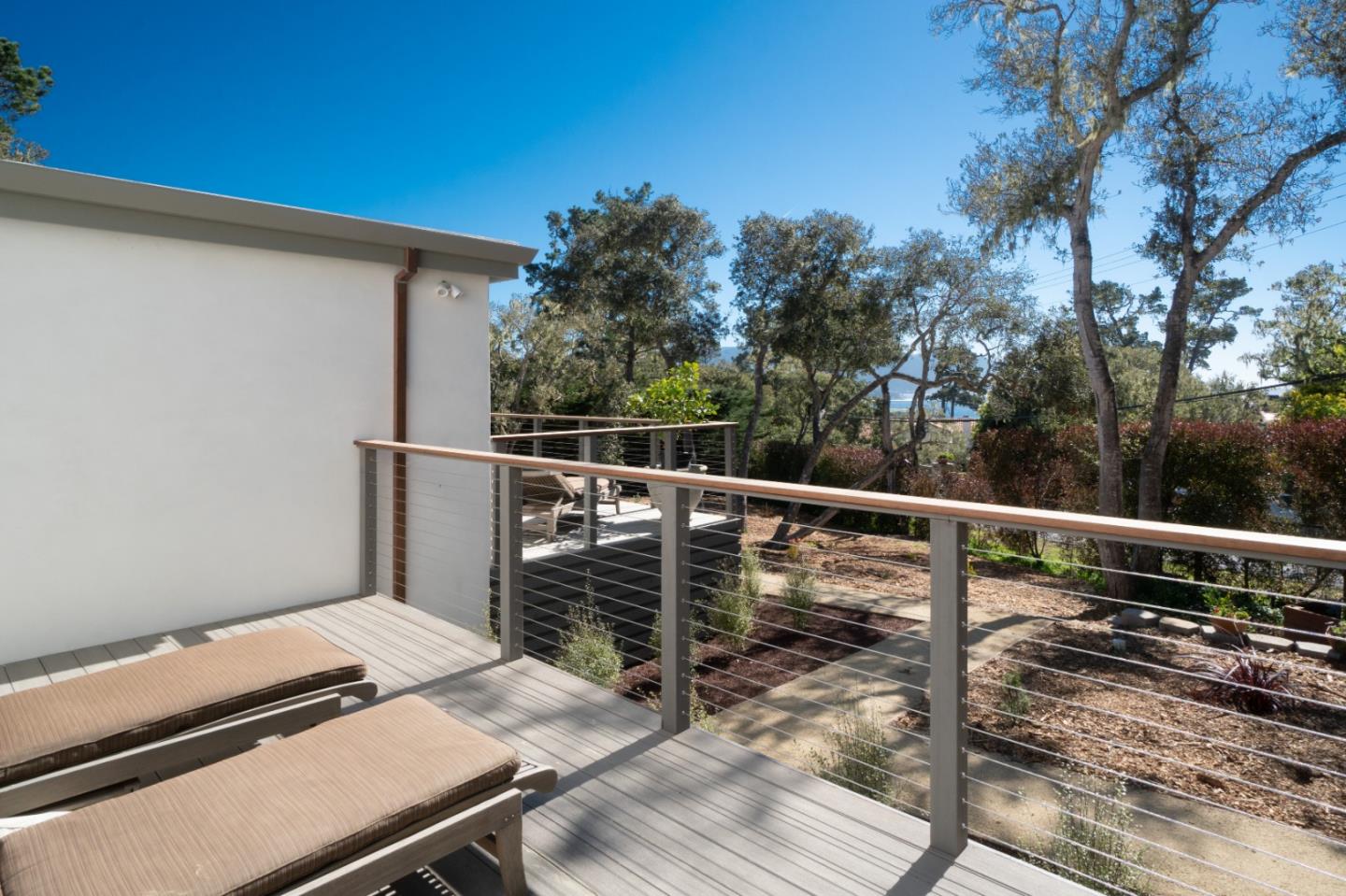 1505 Venadero Road Pebble Beach, CA 93953 - Photo 24 of 36 a balcony with wooden floor and fence