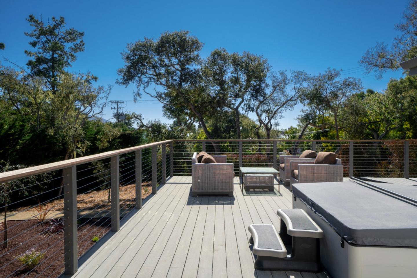 1505 Venadero Road Pebble Beach, CA 93953 - Photo 27 of 36 a view of a roof deck with couches and wooden floor