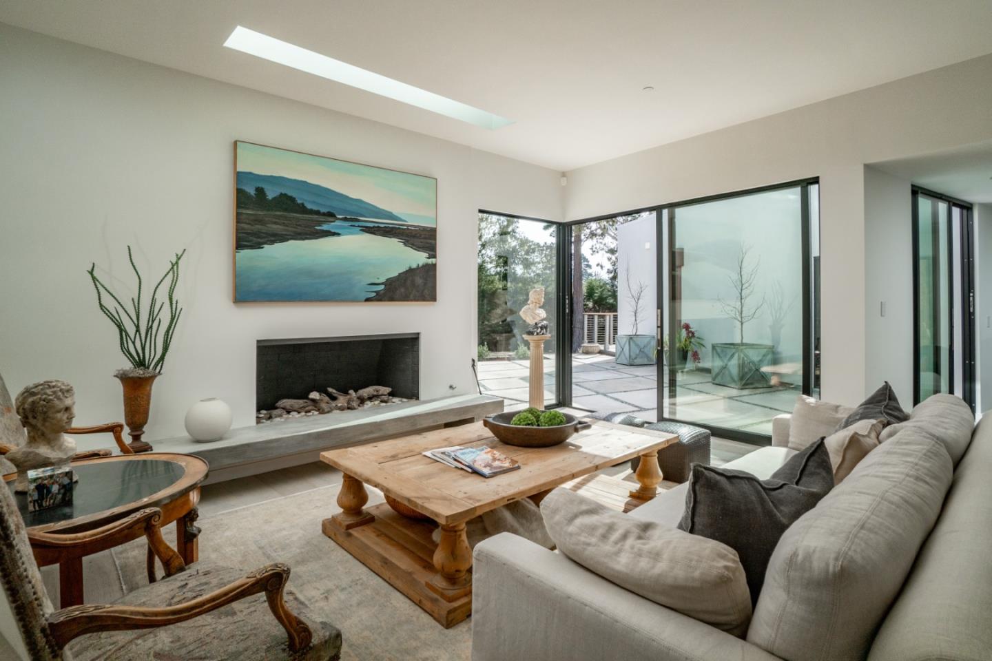 1505 Venadero Road Pebble Beach, CA 93953 - Photo 5 of 36 a living room with furniture fireplace and a large window