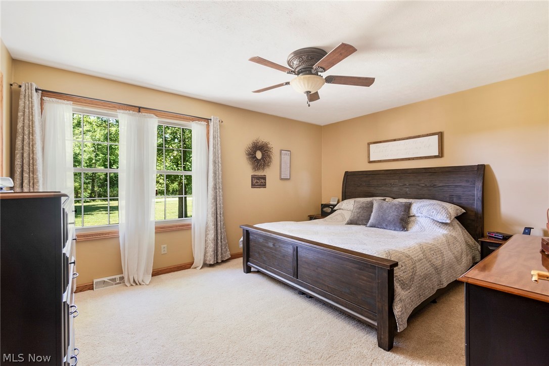 11711 Bandy Road Alliance, OH 44601 - Photo 37 of 50 Bedroom featuring ceiling fan and light colored carpet
