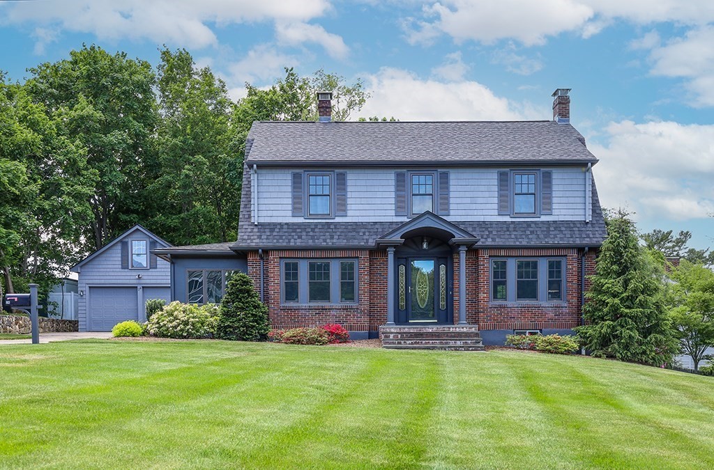 a front view of a house with garden