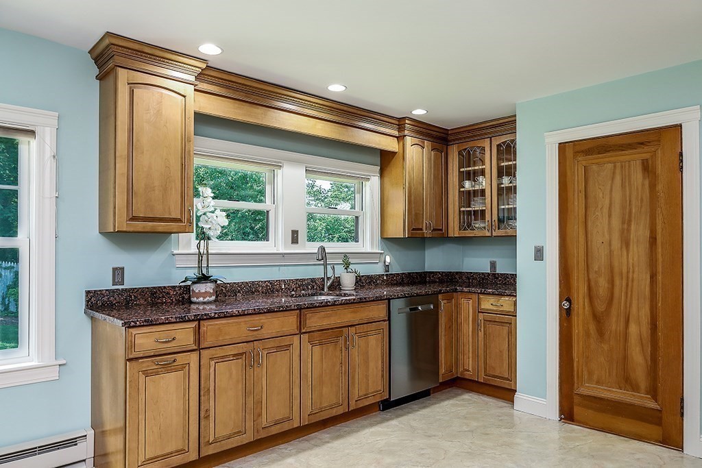 26 Windsor Road Westwood, MA 02090 - Photo 12 of 41 a kitchen with a sink stove and cabinets