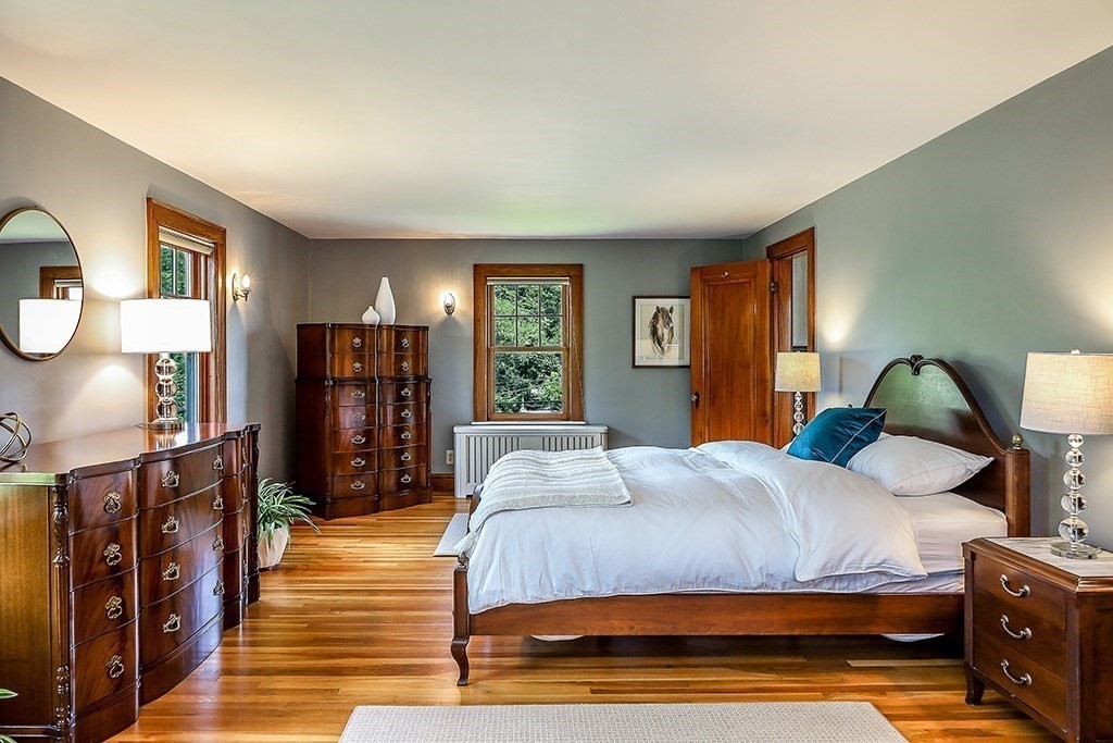 26 Windsor Road Westwood, MA 02090 - Photo 20 of 41 a bedroom with a bed flat screen tv and closet