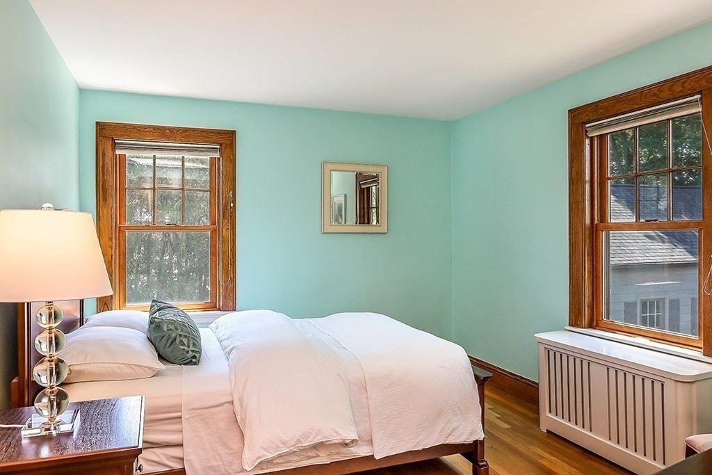 26 Windsor Road Westwood, MA 02090 - Photo 27 of 41 a bedroom with a bed and wooden floor