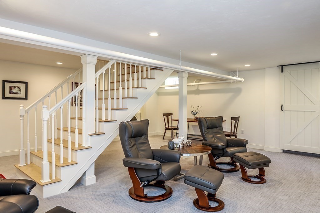 26 Windsor Road Westwood, MA 02090 - Photo 29 of 41 a room with lots of chairs and a chandelier