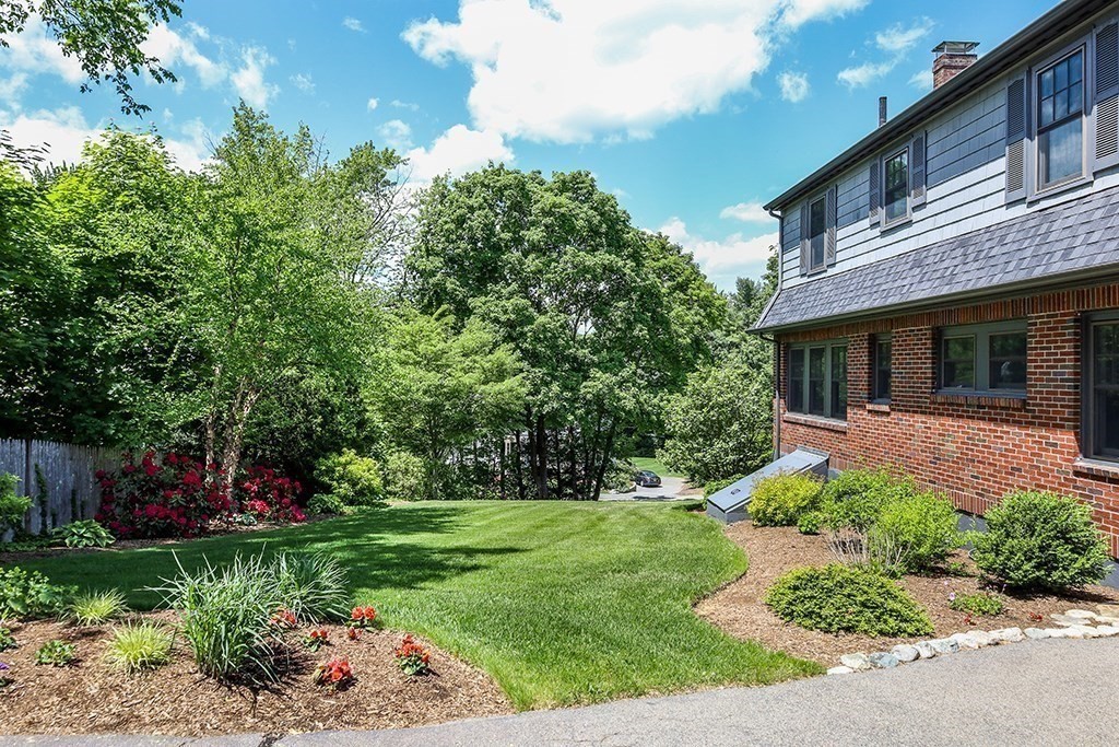26 Windsor Road Westwood, MA 02090 - Photo 34 of 41 a view of a house with a backyard and a garden