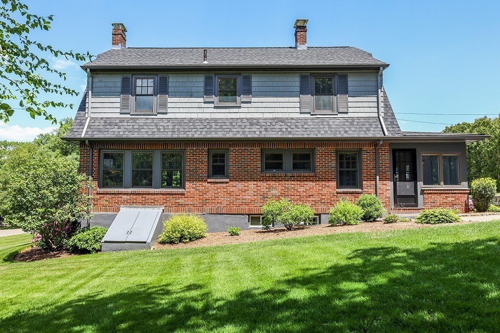 26 Windsor Road Westwood, MA 02090 - Photo 35 of 41 a front view of a house with a yard and porch