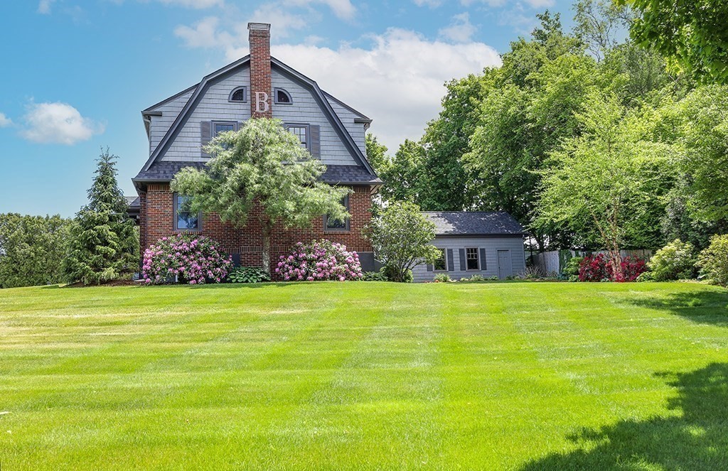 26 Windsor Road Westwood, MA 02090 - Photo 36 of 41 a front view of a house with a yard