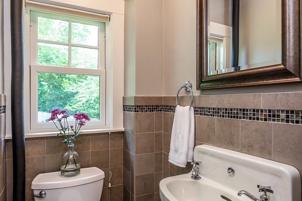 26 Windsor Road Westwood, MA 02090 - Photo 9 of 41 a bathroom with a sink mirror and toilet