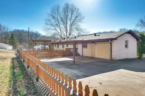 a dining room with furniture and lamp