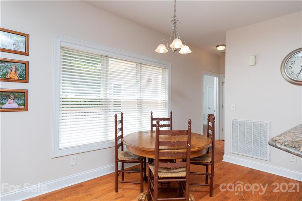 733 Flamingo Road Clover, SC 29710 - Photo 12 of 48 a view of a dining room with furniture and wooden floor