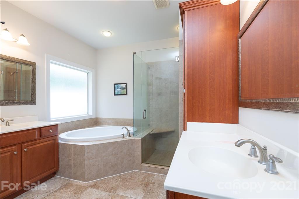 733 Flamingo Road Clover, SC 29710 - Photo 24 of 48 a bathroom with a tub sink and mirror