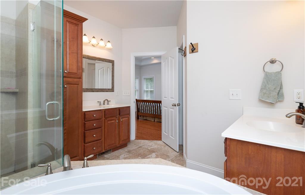 733 Flamingo Road Clover, SC 29710 - Photo 25 of 48 a spacious bathroom with a granite countertop sink and a mirror