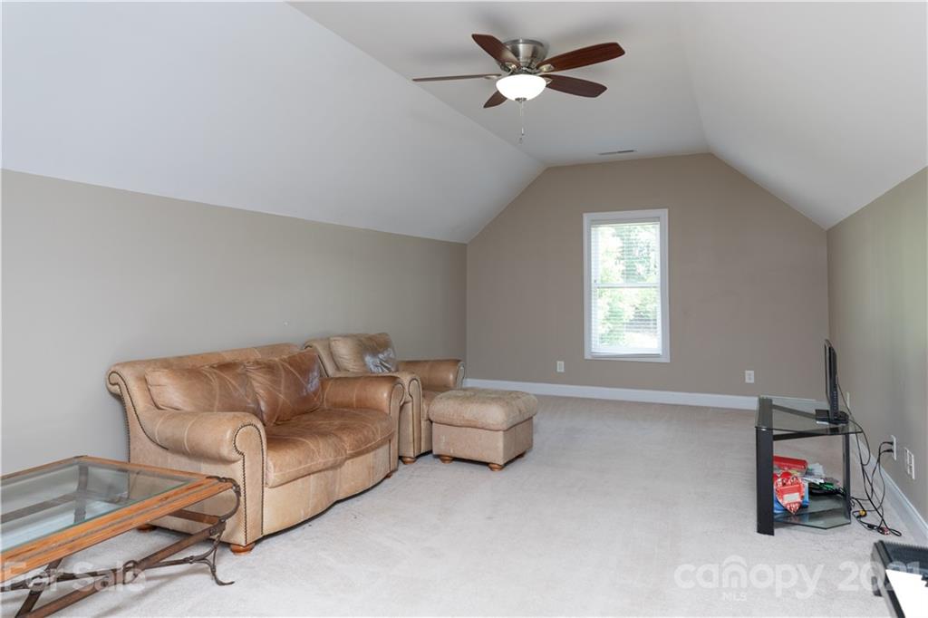 733 Flamingo Road Clover, SC 29710 - Photo 32 of 48 a living room with furniture a ceiling fan and a window
