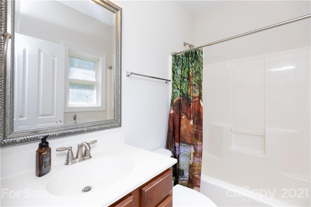 733 Flamingo Road Clover, SC 29710 - Photo 38 of 48 a bathroom with a sink and a mirror