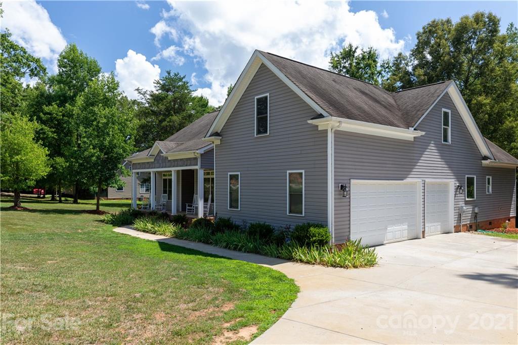733 Flamingo Road Clover, SC 29710 - Photo 45 of 48 a front view of house with yard and trees in the background