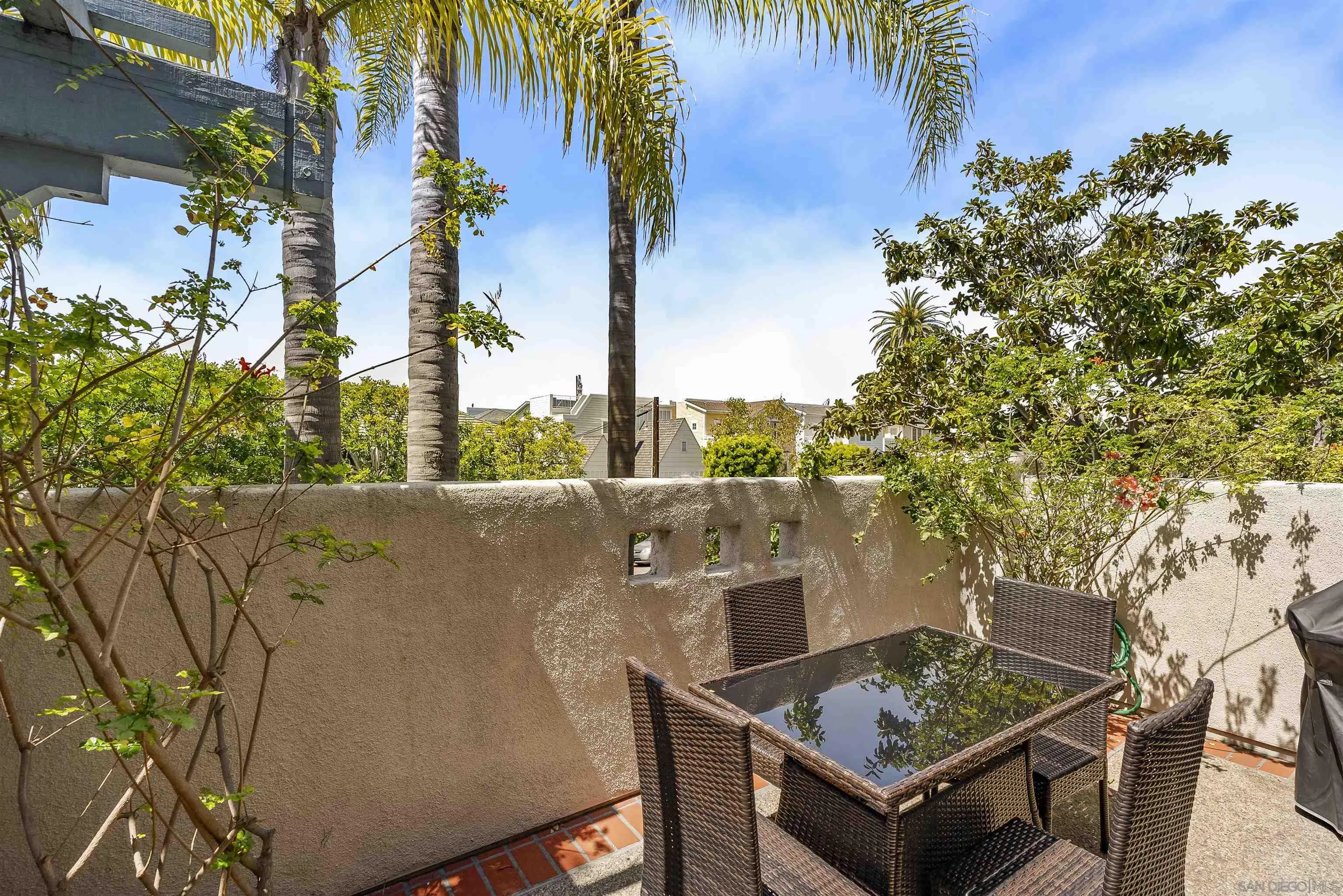 7715 Ivanhoe Avenue La Jolla, CA 92037 - Photo 12 of 28 a view of a terrace with a table and chairs