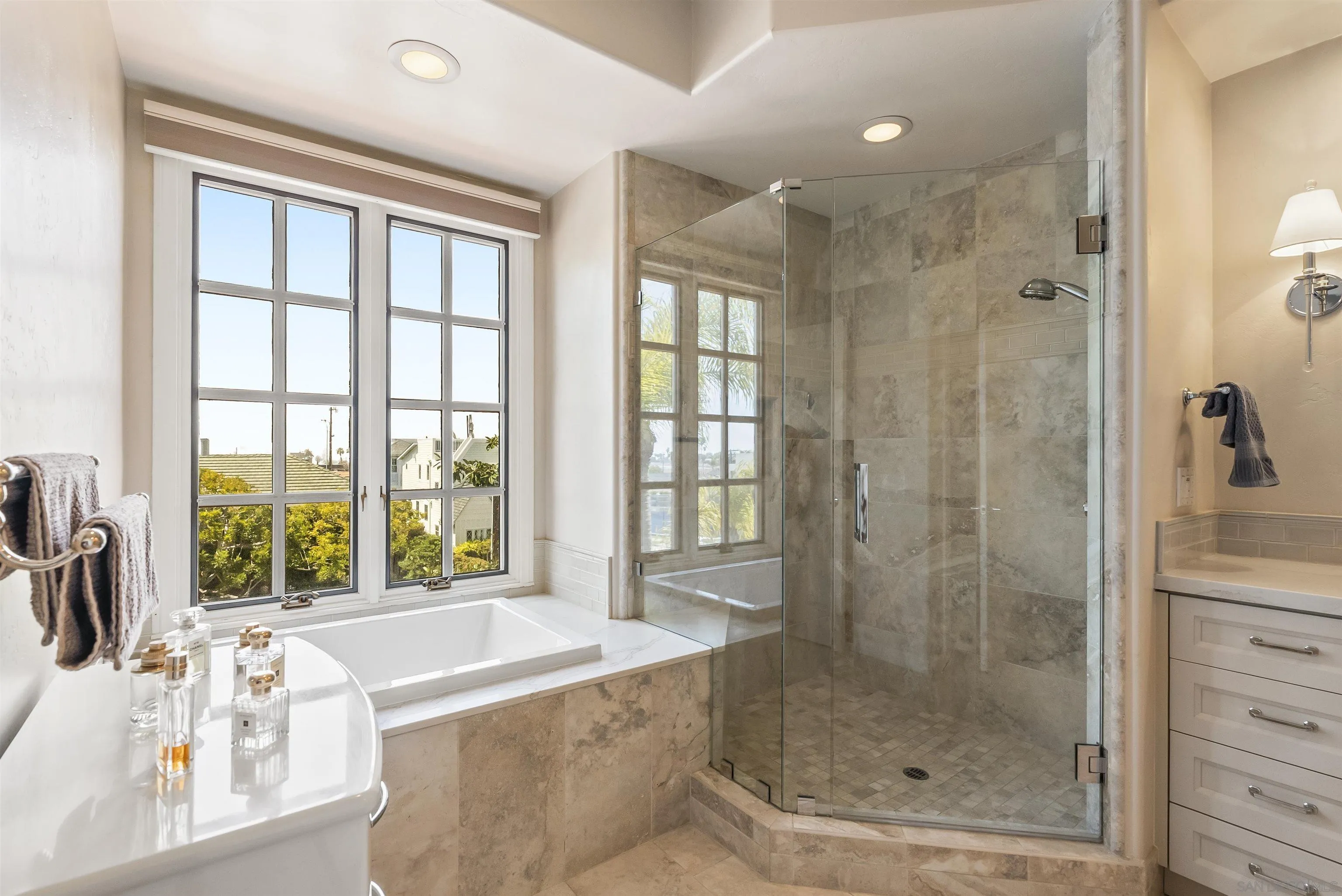 7715 Ivanhoe Avenue La Jolla, CA 92037 - Photo 21 of 28 a bathroom with a bathtub and a shower